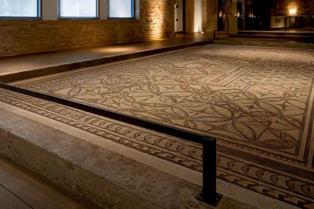 Geometric Roman mosaic in museum gallery