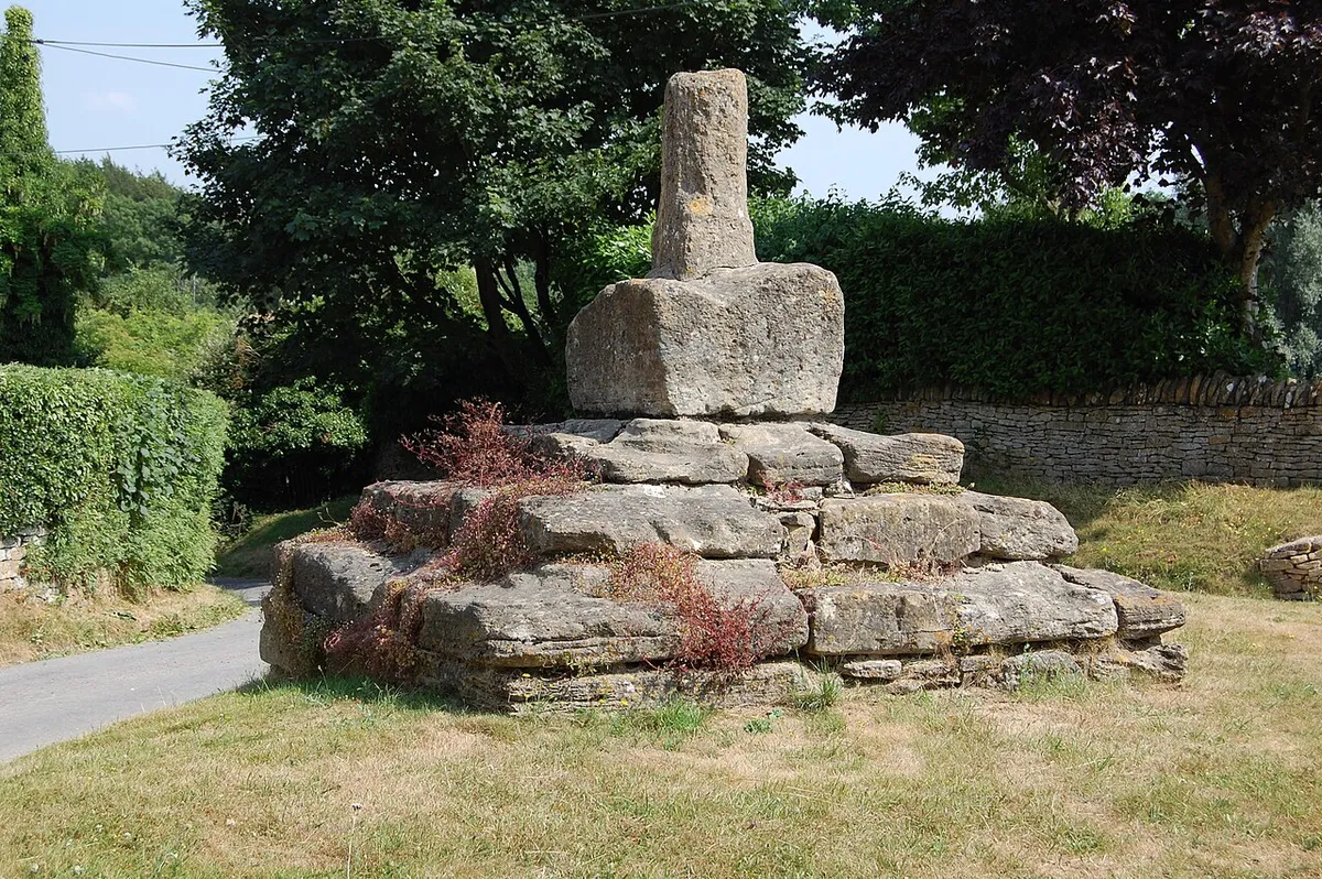 The worn stonework of the "Preaching Cross" at Taston, Oxfordshire, UK.