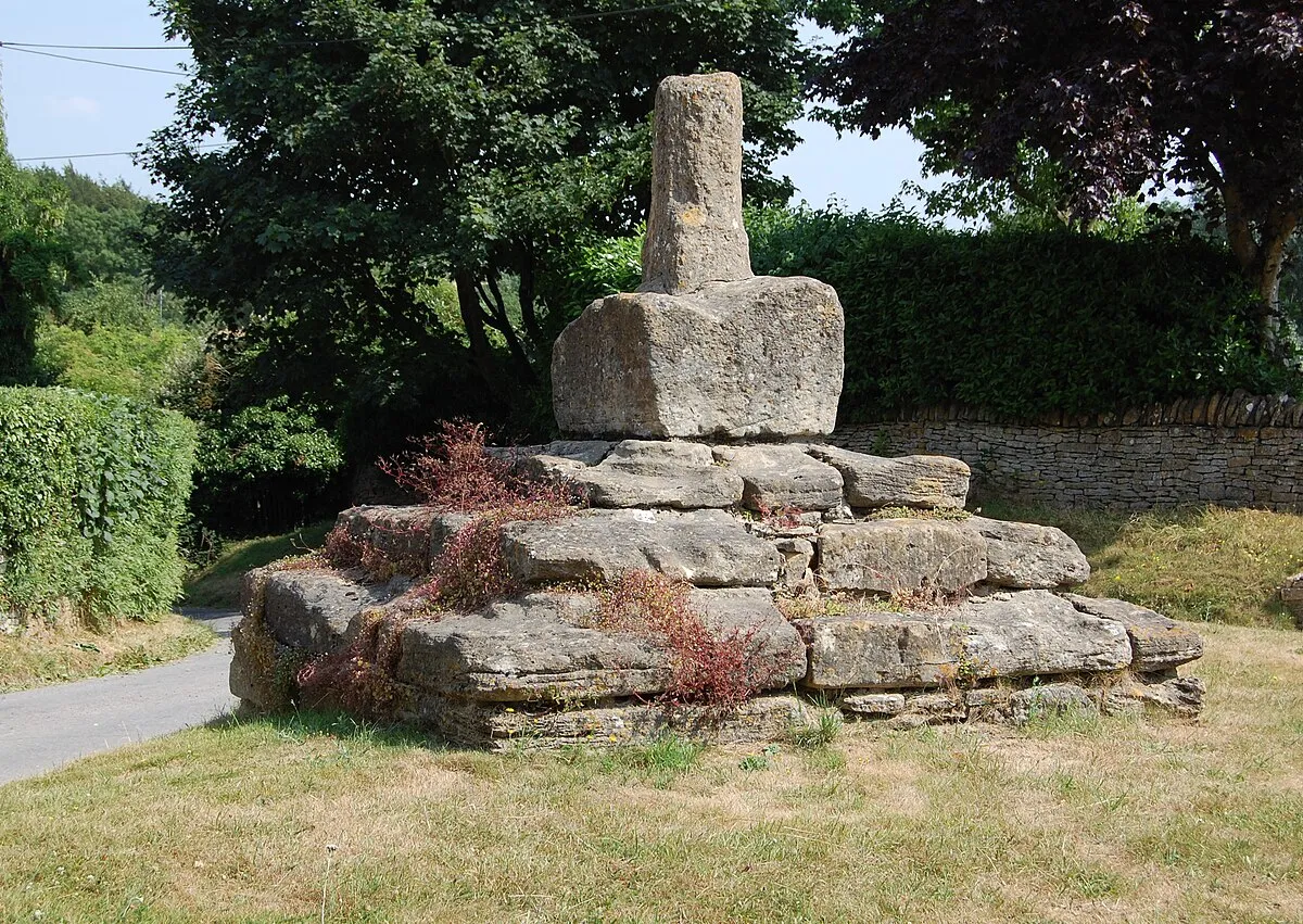 The worn stonework of the "Preaching Cross" at Taston, Oxfordshire, UK.