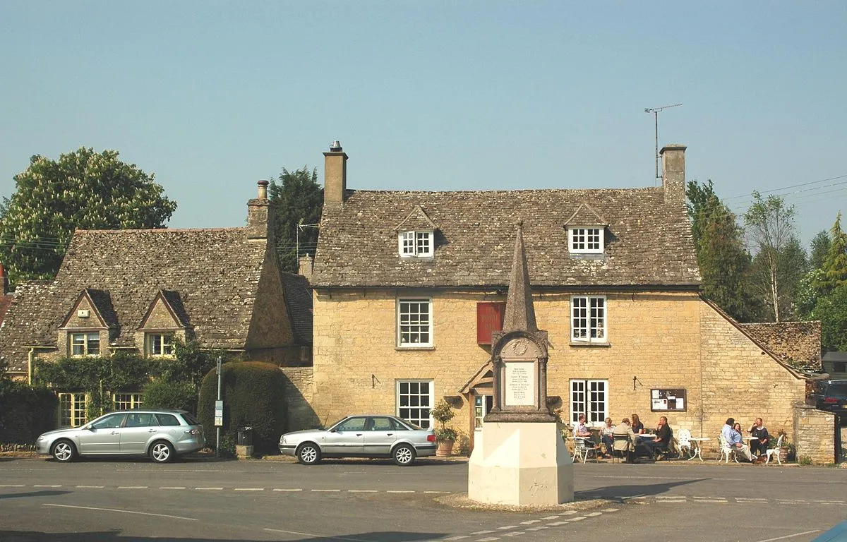 Akeman Cottage (left), the Royal Oak public house (right) and parish war memorial (foreground), Ramsden, Oxfordshire