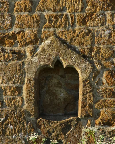 Piscina of the former north chapel of All Saints' parish church, Mollington, Oxfordshire, on the outside of the north wall of the chancel