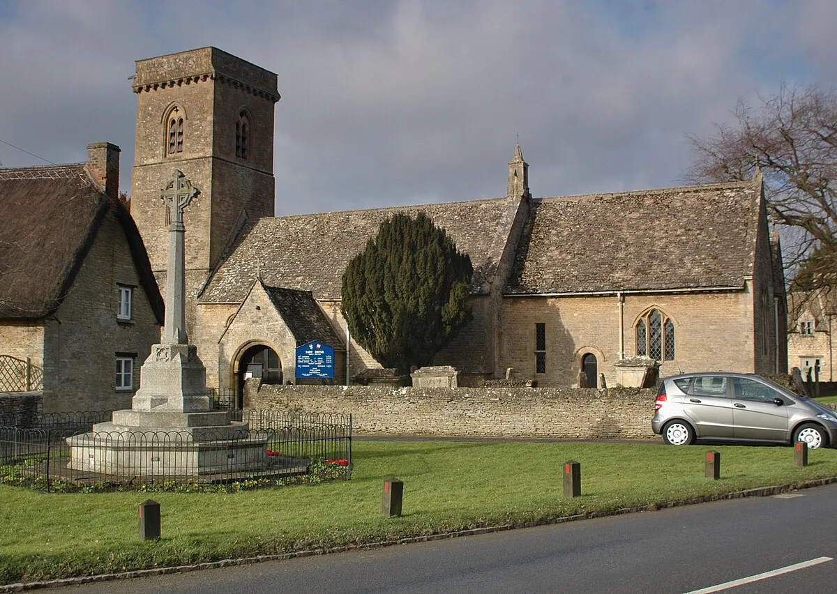 Parish church of St Britius and parish war memorial, Brize Norton, Oxfordshire, seen from south-southeast