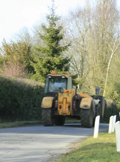 Farm machinery passing Boldehyde Manor That bucket was big enough to give me and my car a lift.