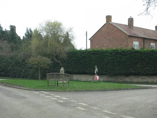 Bench by the remains of the ancient cross in Ripple