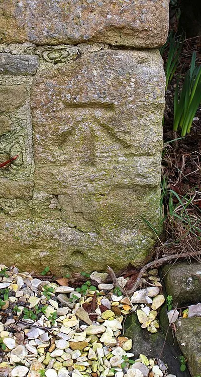 Benchmark on barn conversion house at NE end of Church Road