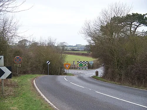 Foss Way crossroads This view is seen from where the driveway to Ditchford Farm starts.  The B4035 runs down to cross the A429 Foss Way.  The crossroads are busy and somewhat dangerous.