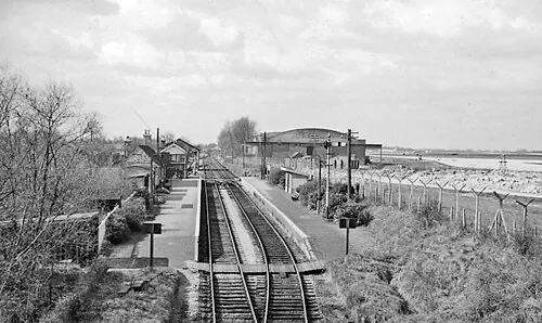 Brize Norton &amp; Bampton Station.
View westward, towards Fairford; ex-GWR Oxford - Witney - Fairford branch, closed completely 18/6/62. The station was called plain 'Bampton' until 1940. On the right is RAF Brize Norton, which at the time of the photograph the USAF (Strategic Air Command) was occupying, with its nuclear-capable bombers.