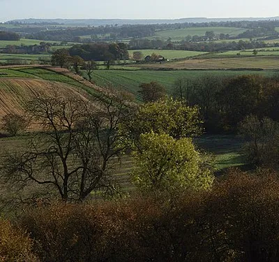 Beneath Martinsell Hill Fields and copses in the vicinity of East Wick Farm from the foot of the eastern slope of the hill.