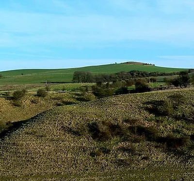 Charlbury Hill from Hinton Parva combe The view point is at a height of about 175 metres above ordnance datum. There is a trig point on the hill at 253 metres aod.