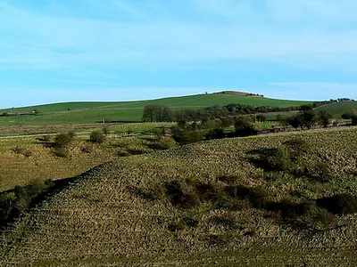 Charlbury Hill from Hinton Parva combe The view point is at a height of about 175 metres above ordnance datum. There is a trig point on the hill at 253 metres aod.