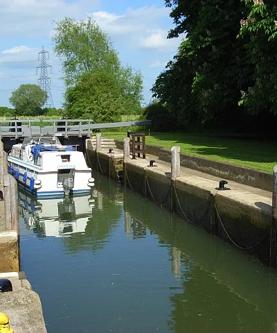 Grafton Lock, River Thames, Oxfordshire: a boat travelling downstream.