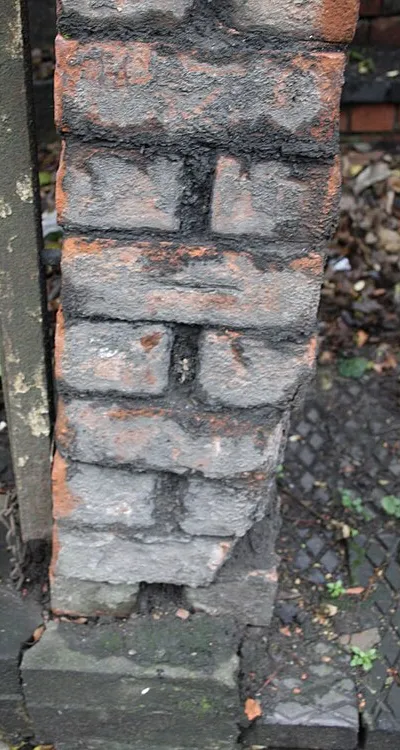 Benchmark on party wall between steps to #2 &amp; #4 Okus Road