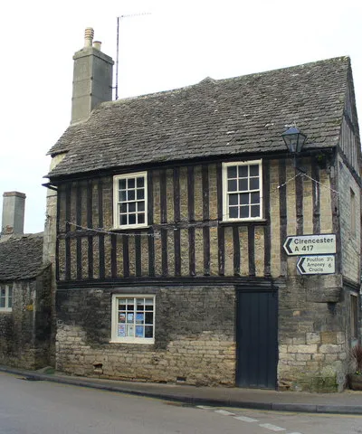 Bridge Street Old stone cottage with half-timbered upper level in central Fairford. To the left is Bridge Street.