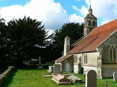 St Andrew's churchyard, Blunsdon St Andrew, Wiltshire: south side of the churchyard, looking west
