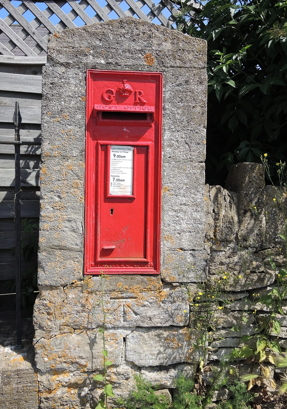 A Georgian letterbox with a benchmark