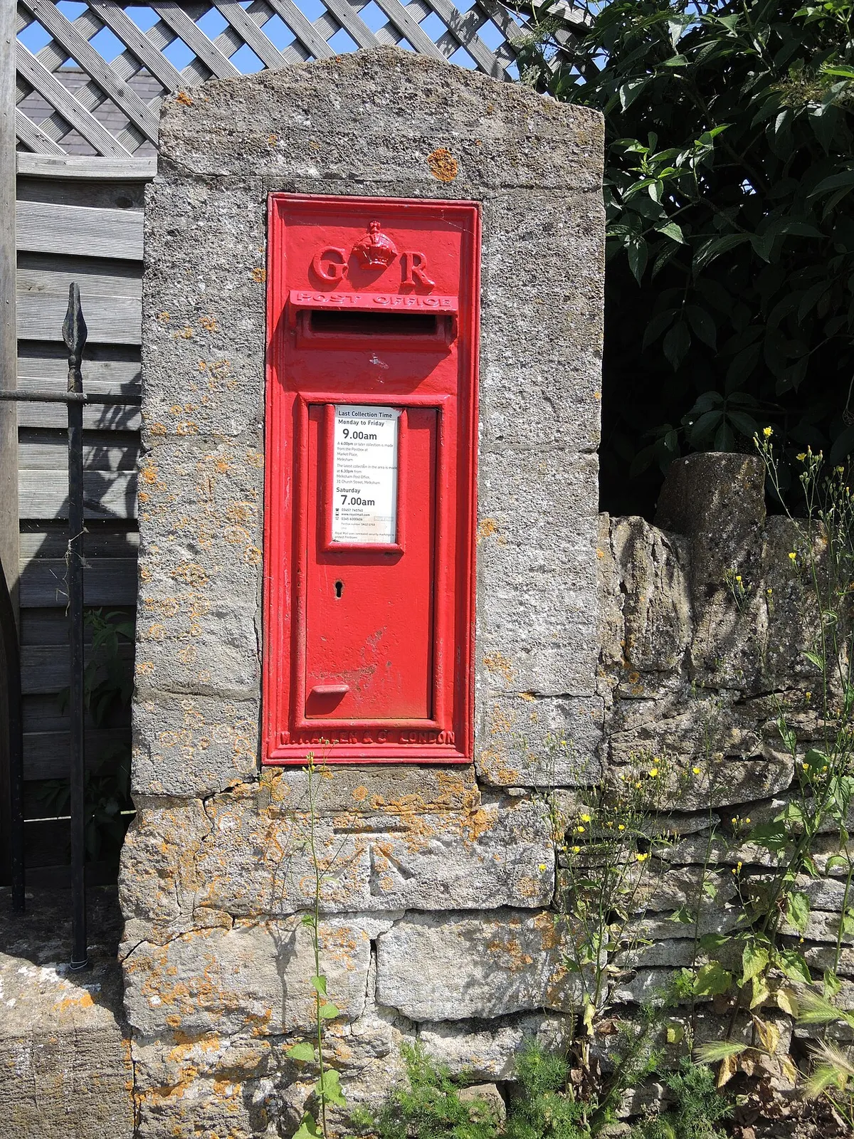 A Georgian letterbox with a benchmark