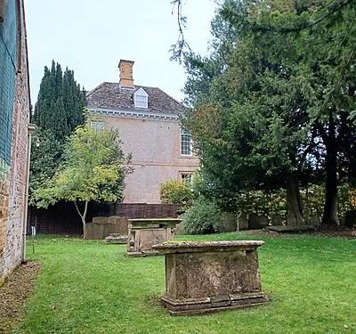 Two chest tombs immediately east of St. Andrew's Church, Kingham, Oxfordshire, England. c.1756 and c. late 18th century. Jointly Grade II listed.