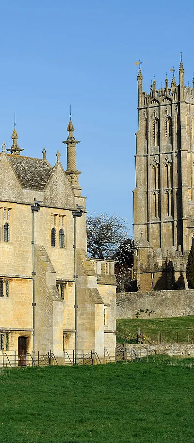 The gate and East Banqueting House of Campden Court and St James's Church in Chipping Campden