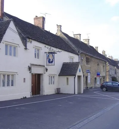 West side of the High Street The closest building, is the former Angel Inn.