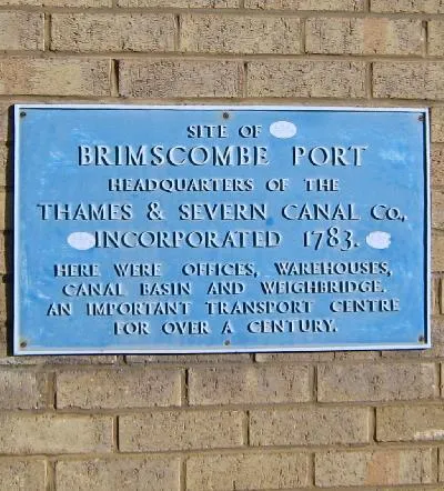 Blue Plaque at Brimscombe Port. This blue plaque on a factory building at the entrance to the site of 1054662 commemorates its historical significance.