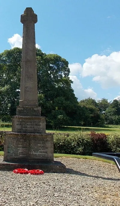 War Memorial Cross, Miserden
Designed by Edwin Lutyens, the Memorial was installed c1920 to the south of the village church. 

The dedication in view is TO THE MEMORY OF OUR GLORIOUS DEAD 1914-1919. The year 1919 is not a mistake. Although the end of the Great War is often stated to date from the armistice of November 11th, 1918, officially a formal state of war persisted until the signing of the Treaty of Versailles with Germany on June 28th 1919.