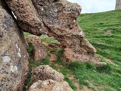 The Banbury Stone, a natural rock outcrop within Kemerton Camp Iron Age hillfort on Bredon Hill, Worcestershire, England. The Stone has folklore attached which says that it goes down to the river to drink at midnight, or alternatively when it hears the bells of Pershore Abbey.