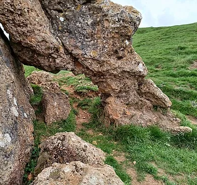 The Banbury Stone, a natural rock outcrop within Kemerton Camp Iron Age hillfort on Bredon Hill, Worcestershire, England. The Stone has folklore attached which says that it goes down to the river to drink at midnight, or alternatively when it hears the bells of Pershore Abbey.