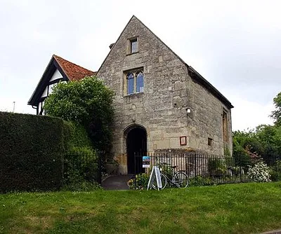 The Chapel of Jesus of Bethlehem (Champs Chapel, middle) and attached priest's house (left), East Hendred, Oxfordshire (formerly Berkshire). The building is now East Hendred Museum. On the right is the parish war memorial.