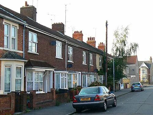 115 to 120 Rosebery Street, Swindon In contrast to many other towns and cities in the UK such as Bath, Bristol, Coventry, Exeter and of course London, Swindon largely escaped the attentions of Hitlers Luftwaffe between the years of 1939 and 1945, largely but not completely. During those years, occasional attacks took place, usually by isolated raiders. In the intervening years all the significant destruction that was caused has been repaired. However, there is still evidence of what happened in those troubled times and the legacy remains in the form of houses that were rebuilt after the war in a style that is similar to but distinct from the originals.
On 20th October 1940, Swindon experienced its first night bombing. An unidentified bomber on a north-south line dropped three bombs, two high-explosive and one incendiary shortly after 22.00 hours. One of the bombs landed in Rosebery Street and destroyed or severely damaged numbers 115 to 120, on the western side of that street. Unfortunately the bomb caused a number of casualties. There were ten confirmed fatalities and an uncertain number of injured persons.
After the war was over the destroyed houses were replaced by new ones built to the same basic design but using different materials and along utilitarian lines. This image shows the houses as they are now and, although they will have been modernised in the intervening years, they remain noticeably different from their older neighbours. The bay windows lack the decorative stonework that graced the original houses and, although the current windows are PVCu, as rebuilt they would have been steel casements in place of the original timber sash windows.

The historical information above was extracted from a monograph Swindon Air Raids in World War 2 by K Walter published privately in 1998, a copy of which can be found in Swindons Central Library.
