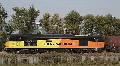 60 087 CLIC Sargeant of Colas Rail hauls the Tilbury-Llanwern scrap train through Milton Park running 40 mins late on 17th Sept 2014