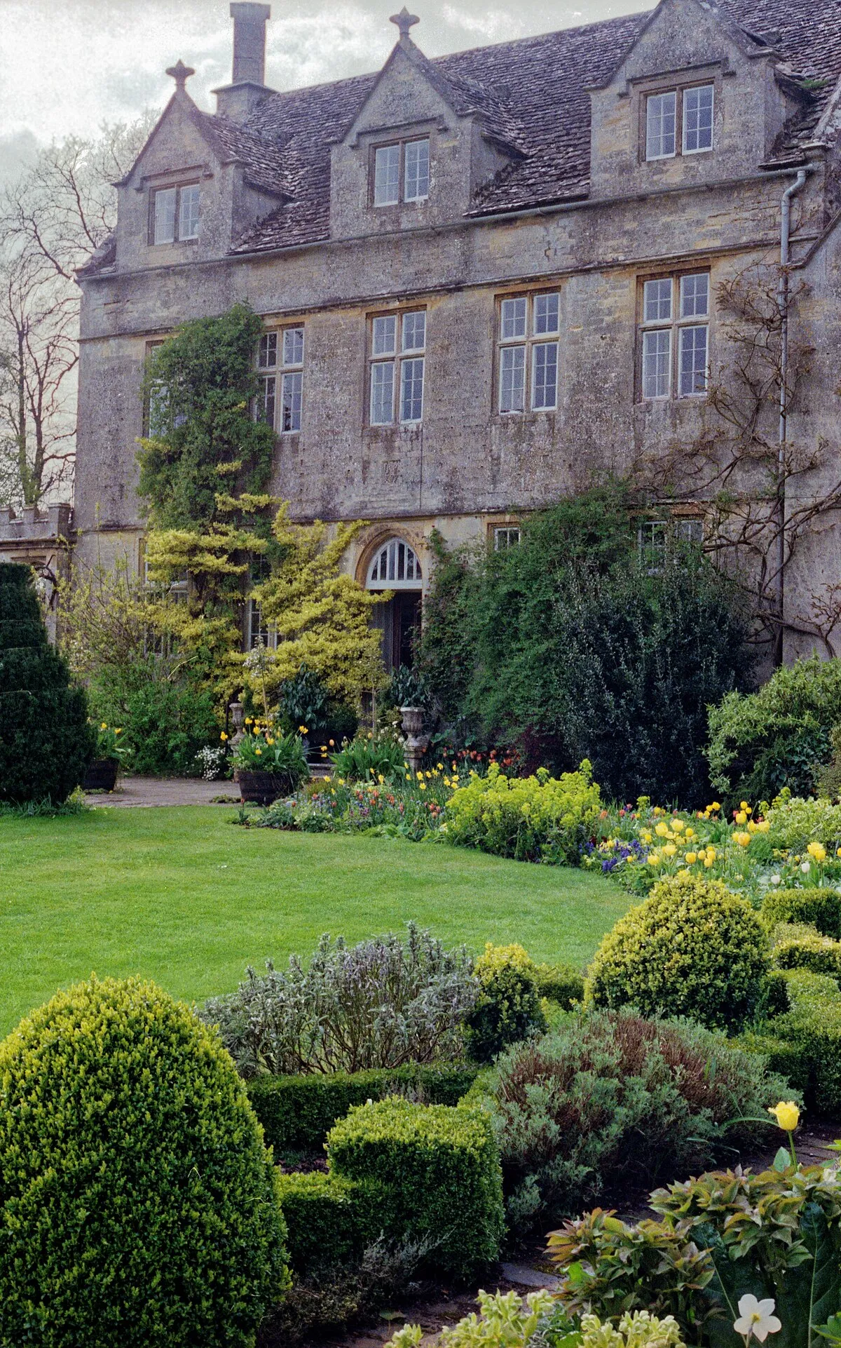 1992 Spring photograph from the gardens at the west of Barnsley House, at the time Rosemary Verey was in residence and directly caring for the garden.Processing: SLR camera Kodak Gold ASA 200-2 film negative scanned with an Epson Perfection V800 using SilverFast 8 scan program, and optimized, cropped and spun with DxO OpticsPro 10 Elite and Adobe Photoshop CS2.