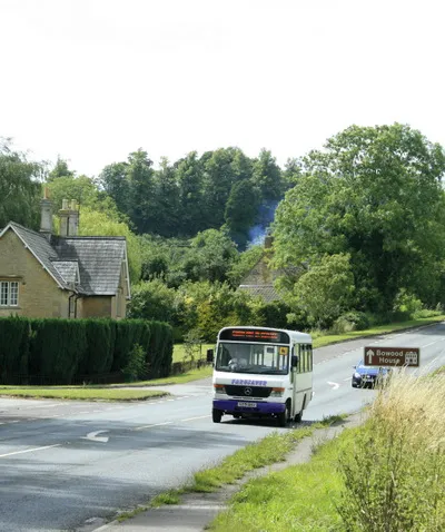 A4 near the bottom of Black Dog Hill A school bus approaches, it won't stop for me.
The "entrance" on the left is an exit from Bowood Park.