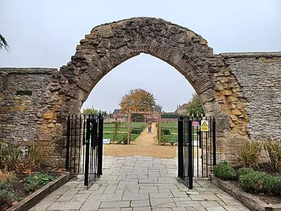 Archway of the former Evesham Abbey, now part of the Abbey gardens. Evesham, Worcestershire, England. Late 13th century. Grade II listed.