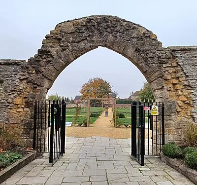 Archway of the former Evesham Abbey, now part of the Abbey gardens. Evesham, Worcestershire, England. Late 13th century. Grade II listed.