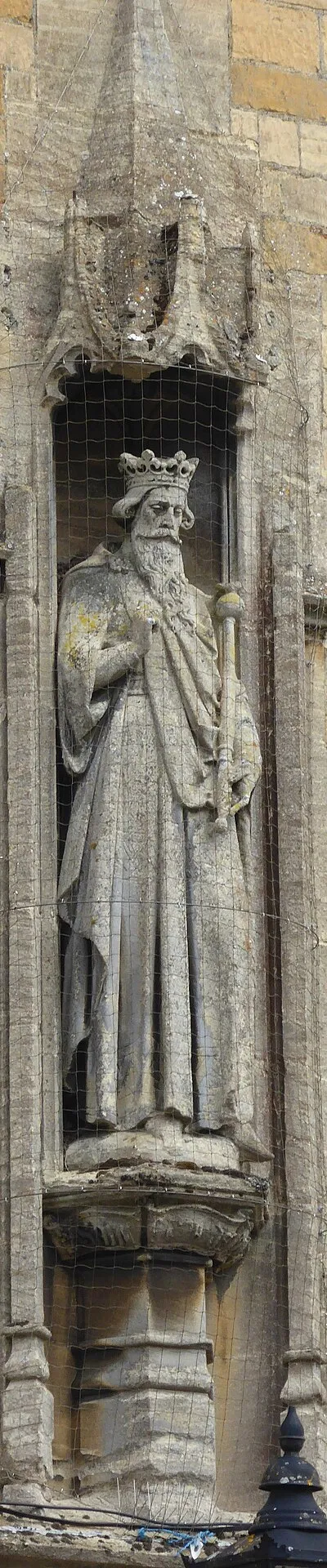 A sculpture of Edward the Confessor on the exterior of the library at Stow-on-the-Wold in Gloucestershire.
