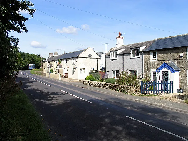 Tiddley Wink: Wiltshire. This strangely named village (reminding me of the game), of which almost all is visible in the photograph, is in the north western section of the square. There is a name-board at the beginning of the village, but it is not marked on the OS Map.