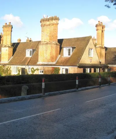 Donnington Hospital almshouses Donnington Hospital was founded by Sir Richard Adderbury in 1393 as a charity to provide alms to 13 poor men of Berkshire, thus making it the oldest charity in the county. The current almshouses here date from around 1602. The website of the Donnington Hospital Trust that owns and manages the almshouses is here http://www.donnington.org/
