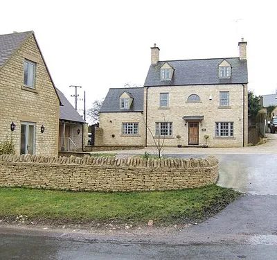 Cotswold House This fine newly-built house stands near the crossroads on the A429 west of Northleach.