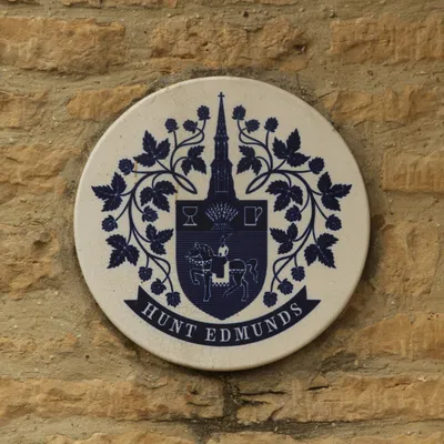 Plaque of the former Hunt, Edmunds brewery on the front of the Chequers Inn, Churchill, Oxfordshire