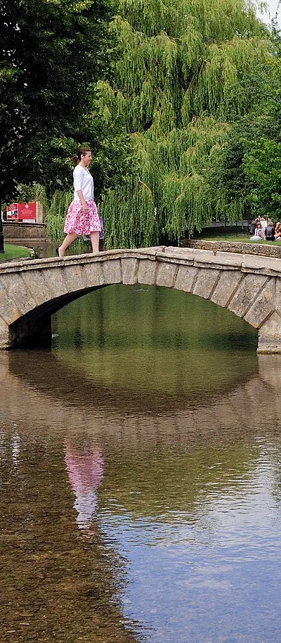 A pedestrian bridge over the River Windrush in Bourton-on-the-Water.