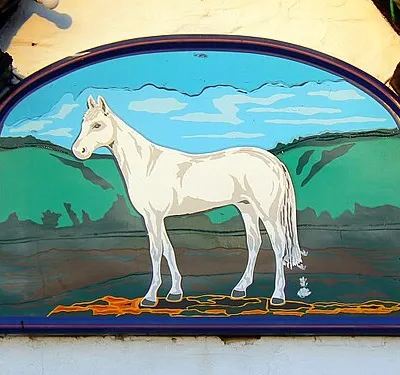 Sign, the White Horse public house, Compton Bassett. It seems likely that the artist who produced the sign took inspiration from a view similar to this 1057639 as the background is remarkably similar.