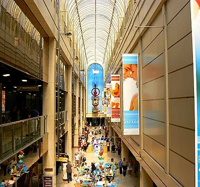 A wider look inside the Regent Arcade, Cheltenham The arcade contains specialist shops such as jewellers, perfumiers and chocolatiers together with larger retailers such as bhs.