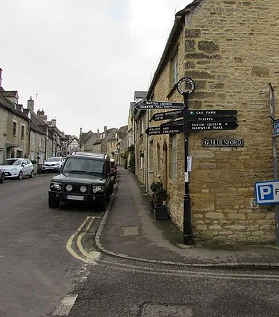 Black signpost on a Burford corner