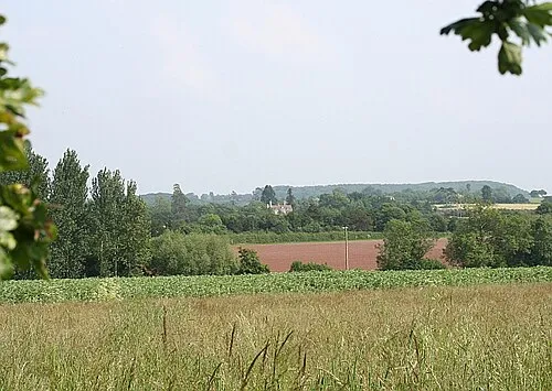 Chambers Court Viewed from Longdon with the heavily wooded Sarn Hill in the background.