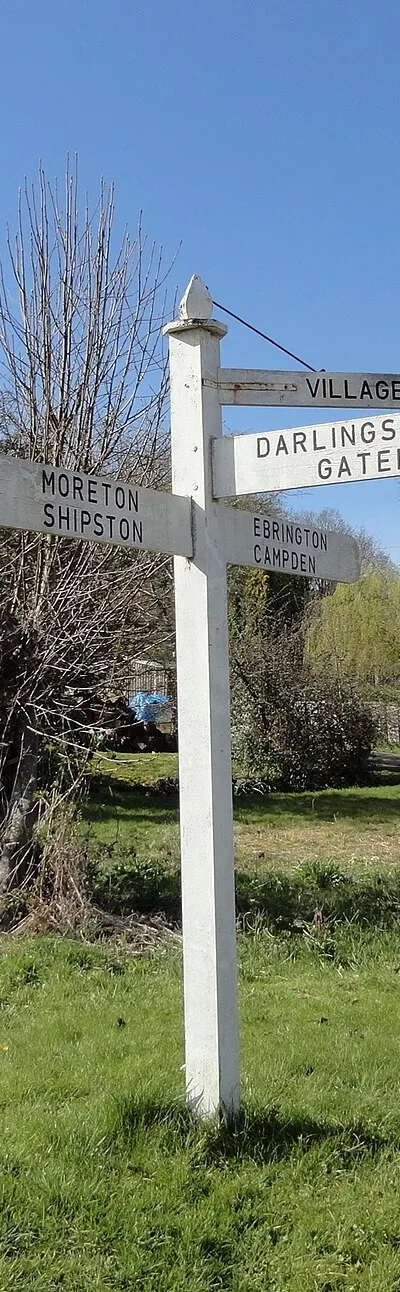 Direction Sign - Signpost on the green at Stretton on Fosse