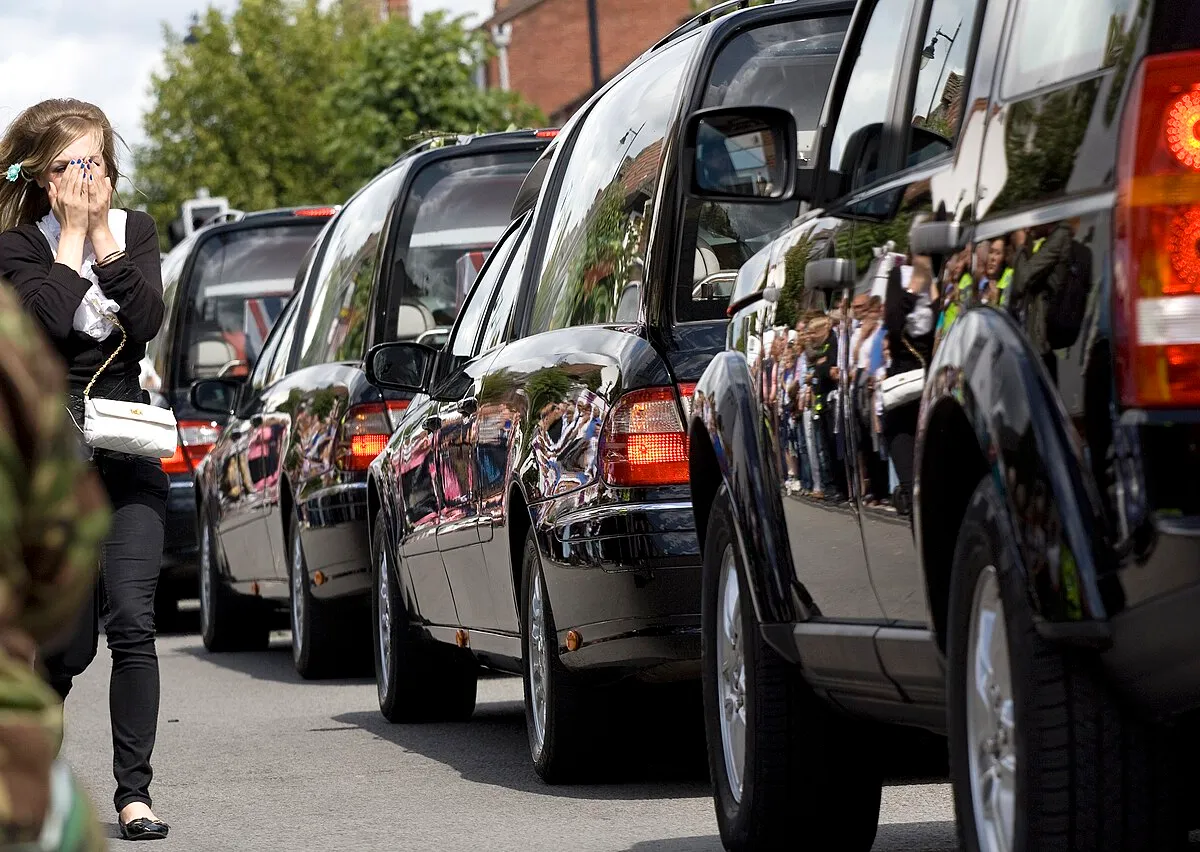A convoy of hearses carrying the bodies of military personnel through Wootton Bassett, Wiltshire, England
