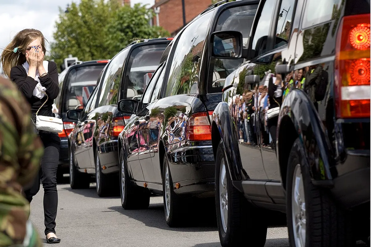 A convoy of hearses carrying the bodies of military personnel through Wootton Bassett, Wiltshire, England