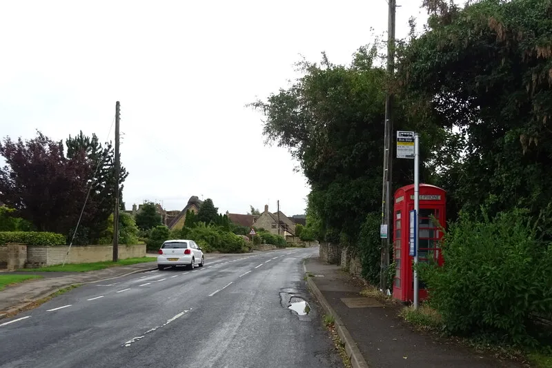 Bus stop and telephone box on Gretton  Road, Gotherington