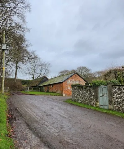 Approaching Manor Farm from Huish Churchyard
