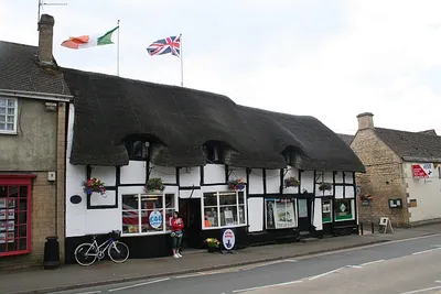 The thatched shop, Prestbury Village Stores, opposite the Kings Arms. A typical village shop selling a variety of items, but unfortunately no string - the days quest. The shop used to be a favourite with Queen Elizabeth, the Queen Mother, who always stopped there on her way to the Cheltenham Races.